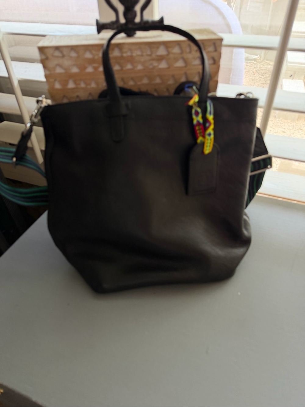 Consuela Black Leather Crossbody Tote with Colorful Charm
